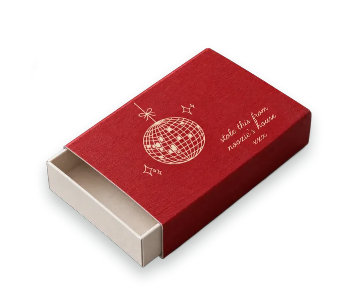 Una caja de cerillas roja personalizada con el dibujo de una bola de discoteca