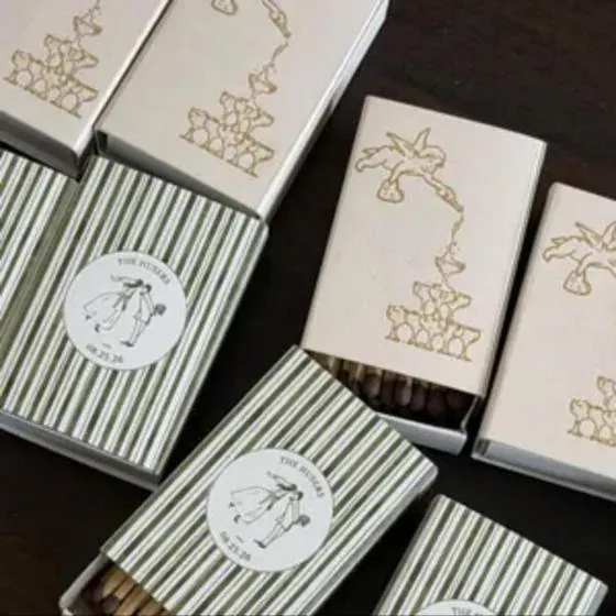 Customer photo of gold illustrated wedding matchboxes with green stripes