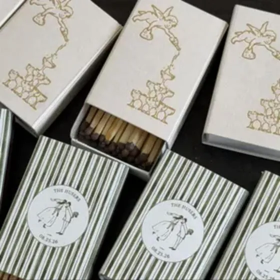 Customer photo of gold illustrated wedding matchboxes with green stripes