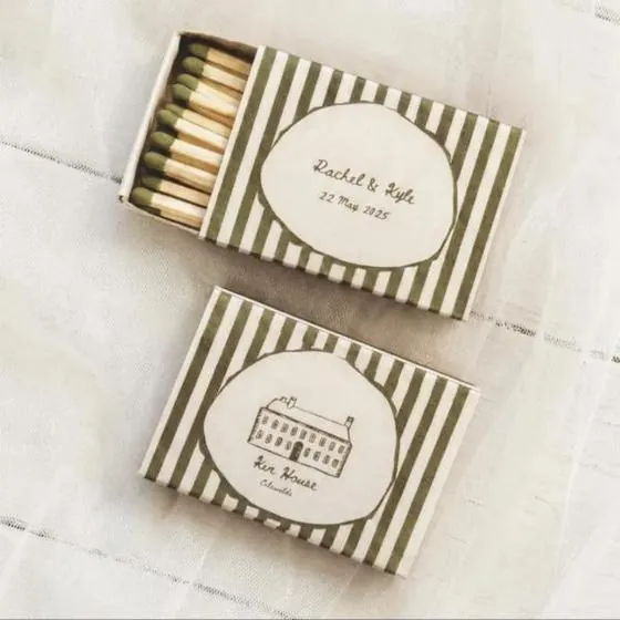 Green striped place card matchboxes with names and a venue drawing