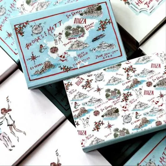 Light blue matchboxes with an illustrated map of Ibiza for a wedding weekend