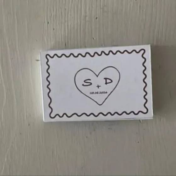 Customer photo of a wedding matchbox with initials in a heart